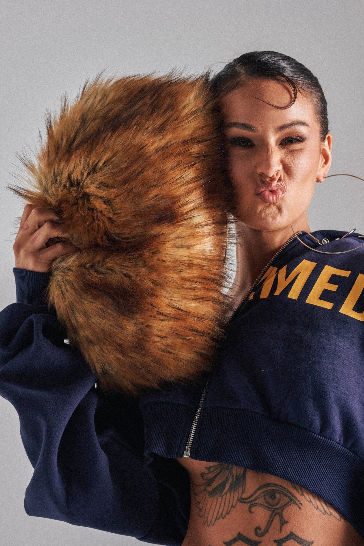 WILD CHILD FAUX FUR CLUTCH